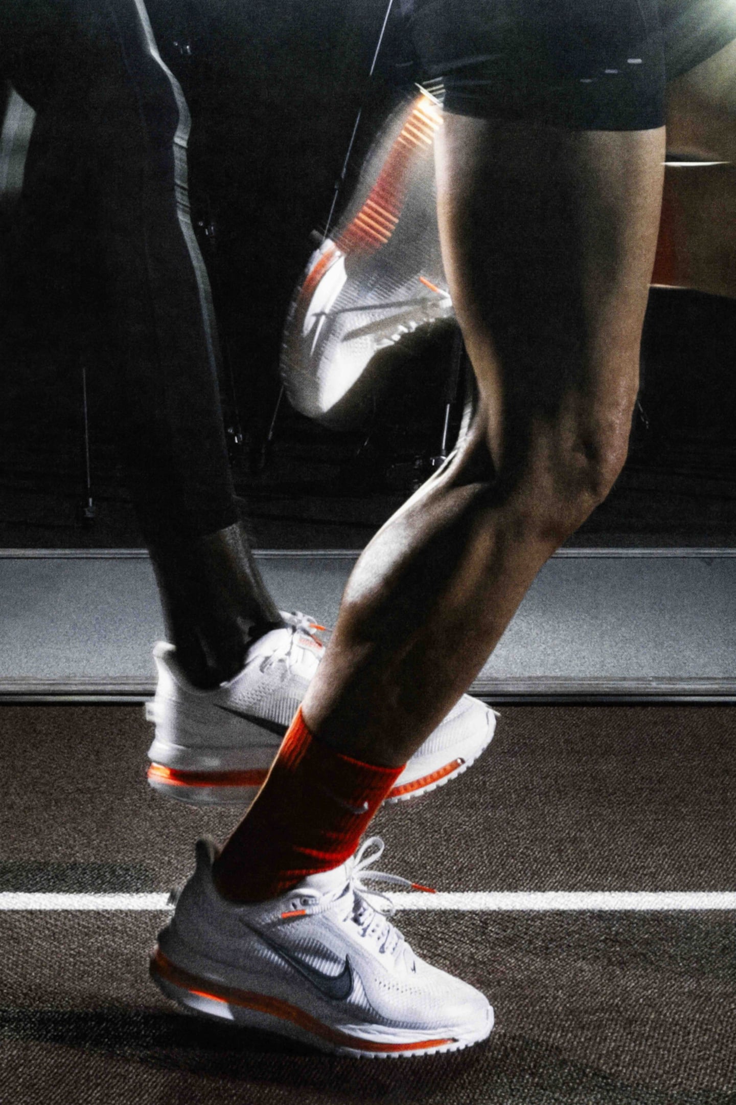 A close up of the muscled legs of runners wearing Nike's Pegasus Premium sneaker.
