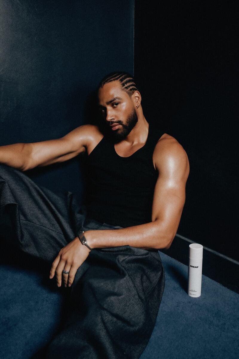 A man sits on the floor