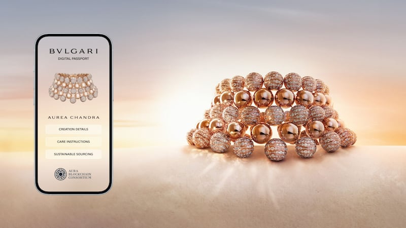 A close up photograph shows Bulgari's Aurea Chandra necklace, which is composed of an array of gold spheres, some embedded with diamonds, alongside the DPP for the necklace.
